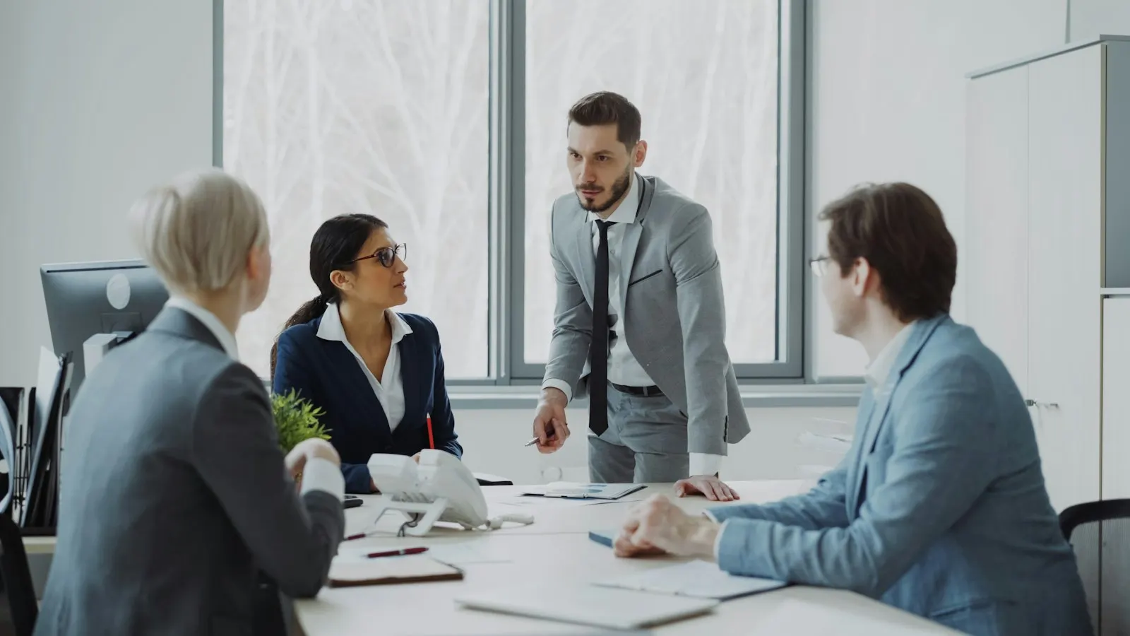 Leadership team gathered around a work table