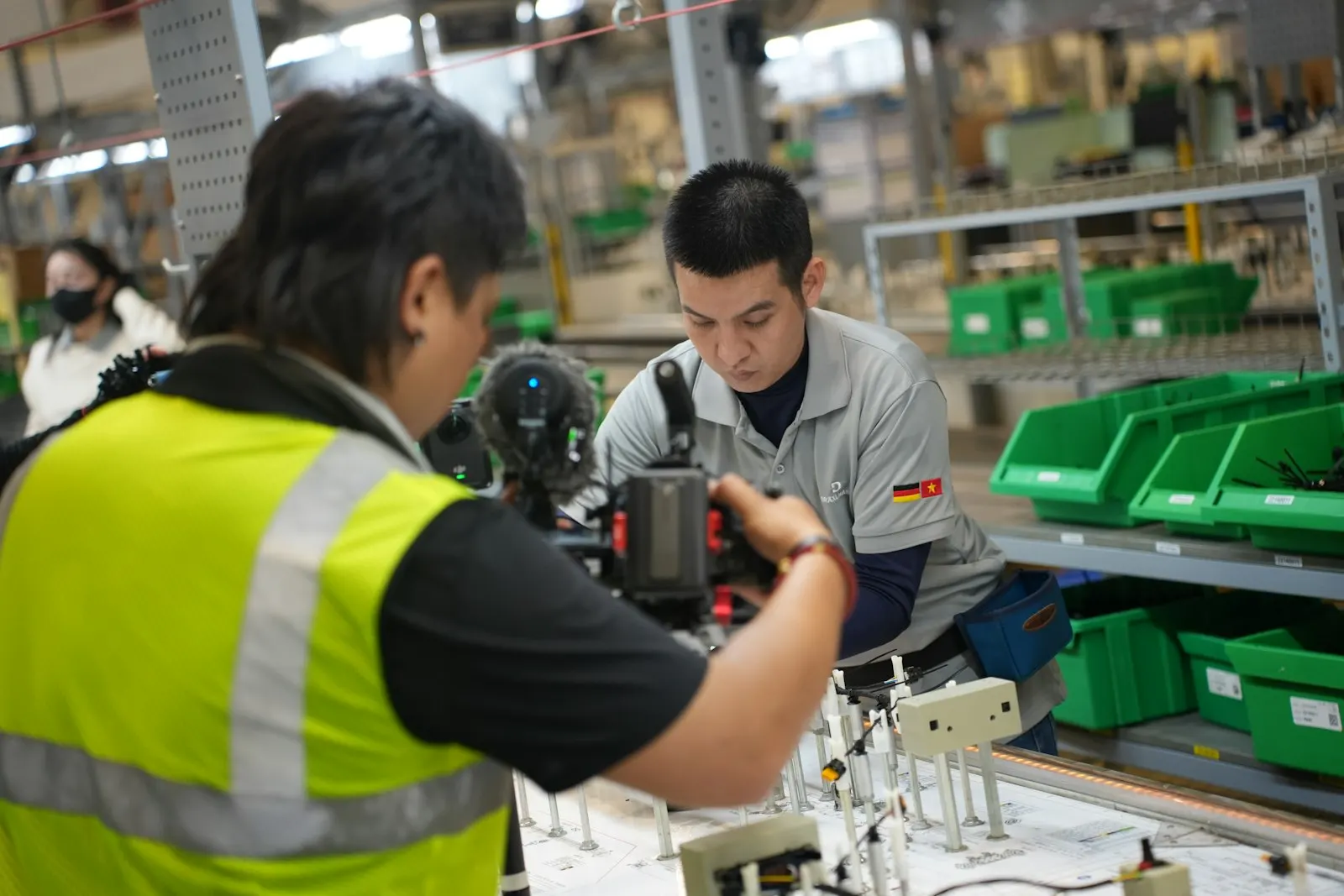 Technicians working on an assembly line